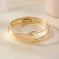 Elegant gold open bangle bracelet for women, minimalist metal arm cuff jewelry accessory. - Square Hollow Buckle Bracelet / Gold
