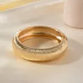 Gold textured open bangle bracelet for women, stylish metal arm cuff vintage accessory. - Striped Arc Oval Bracelet / Gold