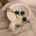 Elegant metal hair claw clip with dark green flocked flowers and pearls for women styling - Flocked Blue Floral