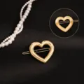 Elegante pinza de pelo de resorte de aleación dorada con forma de corazón para mujer, accesorio. - Hebilla de Rana de Corazón de Oro Brillante