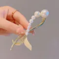 Elegant pearl snake hair clip for women, gold metal hairpin styling claw, secure grip accessory. - Half Fish Tail Pearl