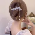 Elegant floral metal hair claw clip with pearl tassel for chic women bun styling accessories. - Cat Eye Heart Gold