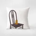 Detailed view of white throw pillow featuring minimalist retro chair illustration, cozy decor. - Style 2