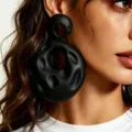 Minimalist black avant-garde statement earrings, irregular hammered hollow drop design. - Black