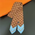 Chic silk twilly scarf with classic monogram pattern and contrast blue ends for women. - 18