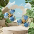 Detailed view of blue enamel flower earrings showcasing intricate gold-rimmed petal textures. - Blue