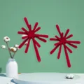 Detail view of striking red firework alloy stud earrings highlighting avant-garde texture. - Red