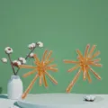 Close-up detail of the gold sea urchin fireworks shape alloy earrings, stylish statement jewelry. - Golden Yellow