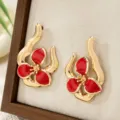 Chic gold-plated red enamel flower stud earrings, sweet geometric design for daily wear. - Red
