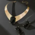 Exquisite gold-toned choker necklace and matching rectangular black stone earrings set. - Black