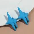 Blue star stud earrings detail view, matte finish minimalist geometric fashion jewelry. - Sky Blue