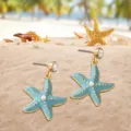 Detail shot of blue starfish earrings with pearl and crystal, perfect for summer beach vacation. - Sky Blue