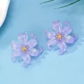 Detailed view of translucent acrylic colorful petal earrings showcasing exquisite flower design. - Light Purple