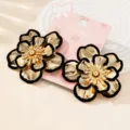 Exquisite metallic flower earrings with elegant black edges, chic detail design for daily wear. - Black