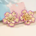 Elegant Korean style flower earrings with gold metal and purple enamel petals, detailed closeup. - Violet
