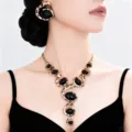 Close-up of bohemian spiral leopard print acrylic gem necklace and matching earring set. - Leopard Print