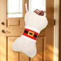 Large knitted Christmas stocking in bone shape with Santa belt design, holiday gift bag. - White