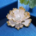 Close-up detail of exquisite gold-trimmed peony flower brooch featuring a central pearl. - Gilded White (White Pearl)