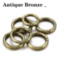 Close up detail shot of antique bronze metal alloy spring rings for handmade DIY crafts. - 25mm (5 Pieces) / Antique Bronze