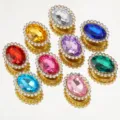 Detailed view of colorful oval glass sew-on rhinestones with gold base DIY hair accessory parts. - Multicolor
