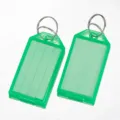 Plastic key tags with split rings and write-on labels for luggage sorting detail shot. - 5.7x1.8cm / Green Dashed Line