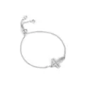 Modieuze zilveren schuifarmband met zirkonia opengewerkte kruisanger voor dames dagelijks. - Hol Kruis Armband / Zilver