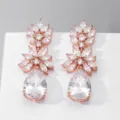 Elegante roségoudkleurige oorbellen met kubieke zirkonia en schitterende kristallen. - Roségoud