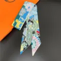 Luxury silk twilly scarf with vibrant floral and animal print, elegant accessory for women. - 15
