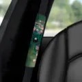 Car seatbelt cover detail showcasing oil painting water lily design with cute black cat pattern. - A-14 Art Cat 03