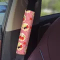 Pink dessert car seatbelt shoulder pad cover detail view, cute strawberry illustration interior accessory. - Pink Dessert 07
