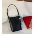Minimalist black leather bucket bag, versatile single shoulder underarm handbag for women variant - With Pendant / Black