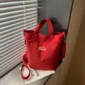 Bolso cubo de lona roja para mujer, bolso cruzado y de hombro informal con asa superior. - Burdeos