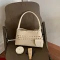 Chic woven shoulder bag for women, stylish PU leather underarm handbag with hollow design. - Off White