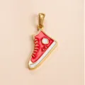 Close-up detail of red enamel high-top sneaker pendant, gold plated metal accessory. - DZ1459 Red White