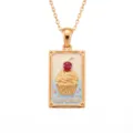 Detailed view of the gold-plated tarot card necklace featuring a cute cupcake design with red crystal. - Cupcake Square Necklace