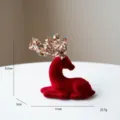 Red flocked Christmas deer figurine with sequin crown ornament for festive table decor. - Small Sitting Turning Head Deer Ornament