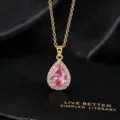 Detailed close-up of the elegant pear-shaped pink zirconia pendant necklace in gold tone. - Teardrop / 40+5cm / Pink