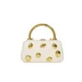 Detail view of cream white hard shell evening clutch bag with gold pebble studs and handle. - Off White