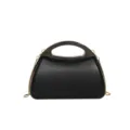 Exquisite black acrylic evening bag detail, featuring sleek metallic handle and fine chain. - Gunmetal