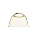 Close up view of the elegant off-white hard shell evening bag with luxury gold metal handle. - White