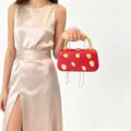 Elegant red hardshell clutch bag with gold metallic handle and studs for women evening parties. - Red
