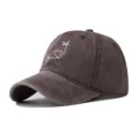 Close-up detail of the washed cotton baseball cap featuring white wave heart palm tree embroidery. - Adjustable / Coffee
