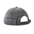 Detail view of the retro washed denim docker cap showing adjustable metal strap and brim. - Adjustable / Washed Army Green