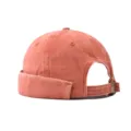 Detailed view of the washed orange brimless docker cap showcasing its texture and metal buckle. - Adjustable / Washed Orange