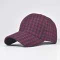 Detailed view of the red and black plaid baseball cap, showcasing cozy woolen fabric texture. - Adjustable / Symmetrical Black (07)