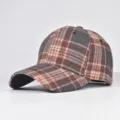 Detailed view of the autumn winter woolen plaid baseball cap, structured hard top, curved brim. - Adjustable / 24
