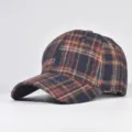 Close-up detail of the classic plaid wool baseball cap, showing texture and stitching. - Adjustable / 19