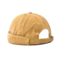 Detail shot of a vintage washed denim docker cap, stylish brimless miki hat for street fashion. - Adjustable / Washed Yellow