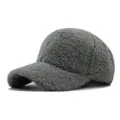 Close-up detail of the thick lamb wool baseball cap, soft fleece texture and warm grey color. - Adjustable / Light Green