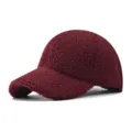 Thick shearling fleece baseball cap closeup showing soft texture and curved brim detail. - Adjustable / Burgundy